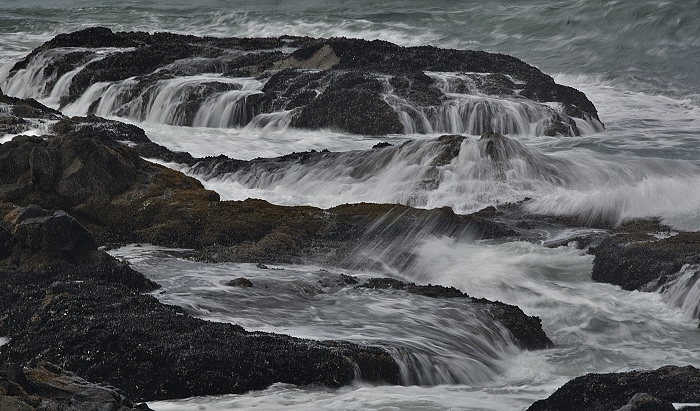 rushing water over rocks in slow motion